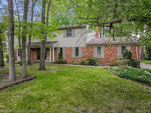 6750 Limerick Ln, Troy, MI 48098 - view of front facade featuring brick siding and a front yard