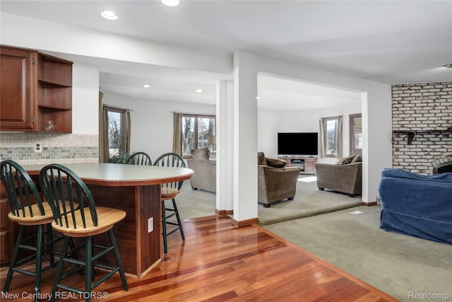 6750 Limerick Ln, Troy, MI 48098 - dining area featuring wood finished floors, recessed lighting, and a fireplace