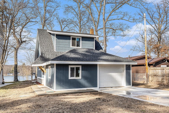 5557 Front St, Newaygo, MI 49337 - exterior space with fence, driveway, a chimney, a shingled roof, and a garage