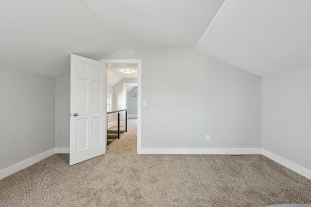 bonus room featuring baseboards, lofted ceiling, and carpet