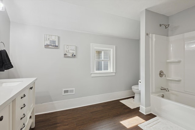 full bathroom with vanity, wood finished floors, visible vents, baseboards, and toilet