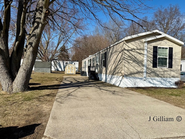 view of property exterior featuring driveway