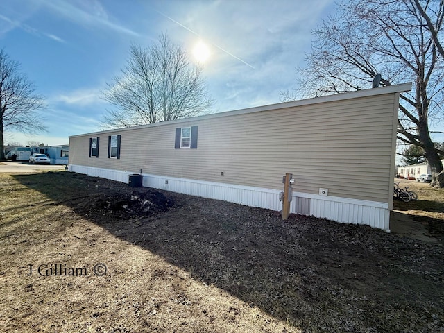 view of side of property with central AC