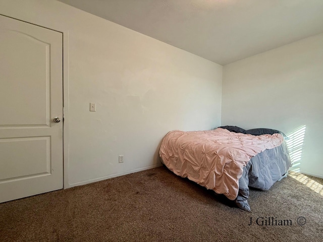 carpeted bedroom with baseboards