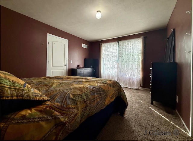 carpeted bedroom featuring visible vents