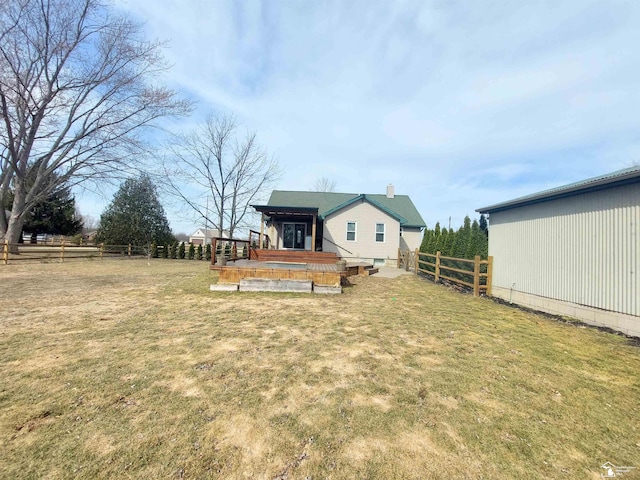 exterior space with a deck and fence