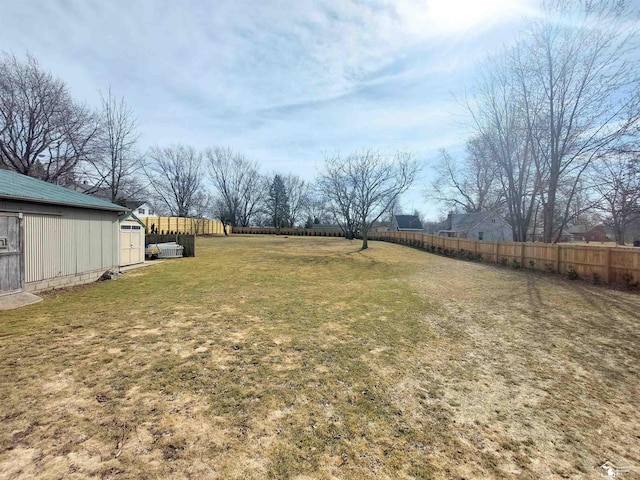 view of yard featuring an outdoor structure and fence private yard