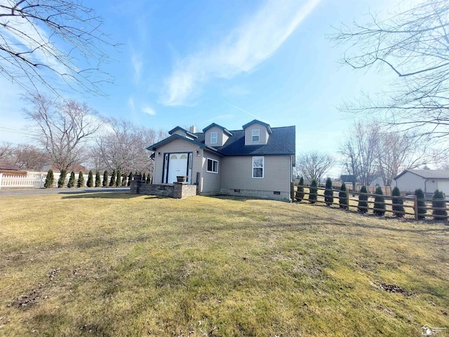 exterior space featuring crawl space, a front yard, and fence