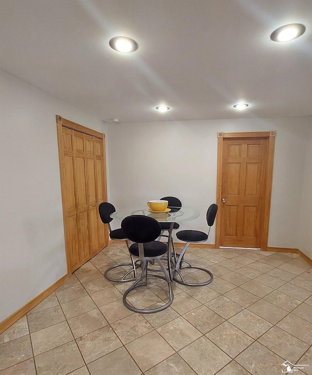 dining area with light tile patterned floors, baseboards, and recessed lighting