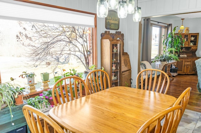 dining room with a notable chandelier and wood finished floors