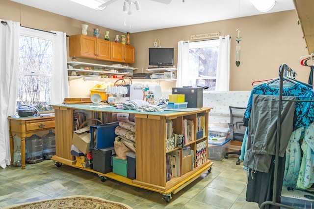 kitchen featuring a wealth of natural light and ceiling fan