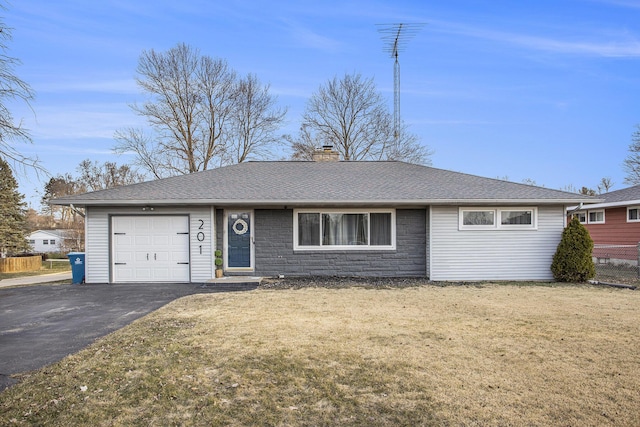 ranch-style house featuring a front lawn, a chimney, a garage, stone siding, and driveway