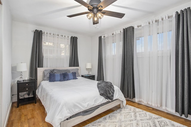 bedroom with wood finished floors and ceiling fan