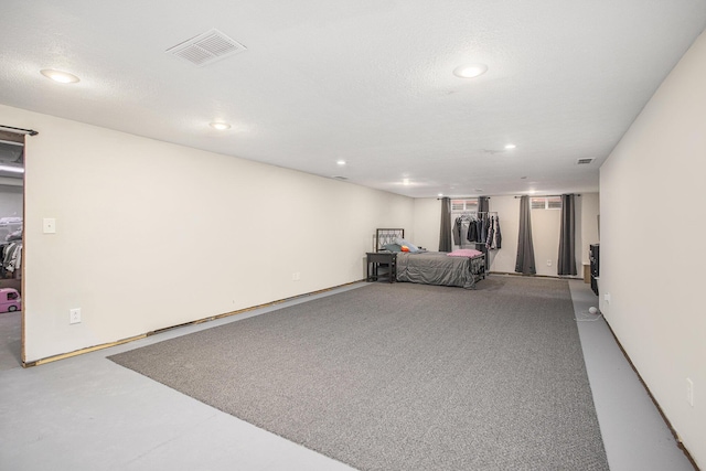 garage with recessed lighting and visible vents