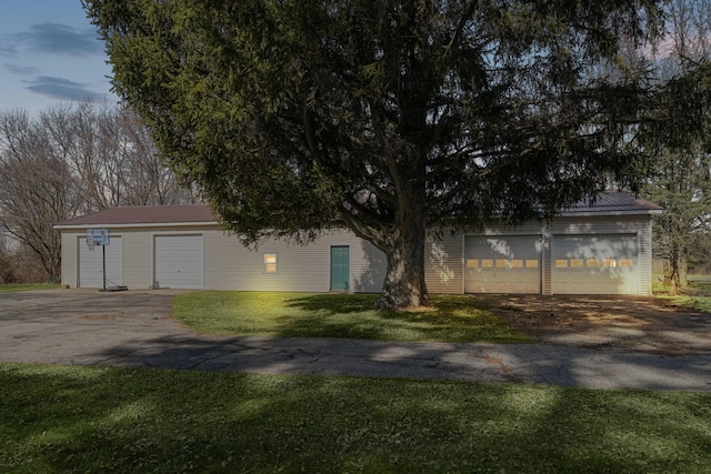 view of front facade with metal roof and a front yard