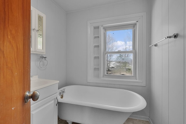 bathroom featuring a freestanding tub and vanity