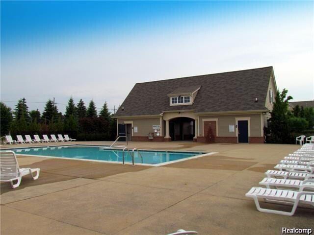 pool featuring a patio area