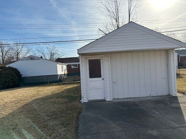 garage with fence