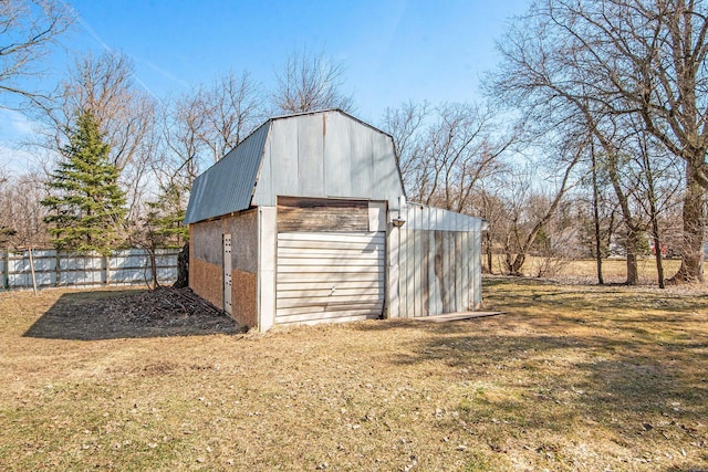 view of outbuilding featuring an outbuilding and fence