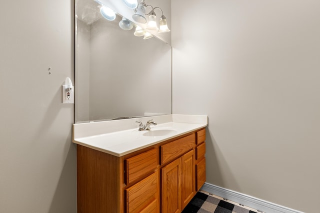 bathroom with vanity and baseboards