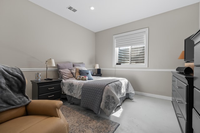 bedroom with visible vents, recessed lighting, finished concrete flooring, and baseboards