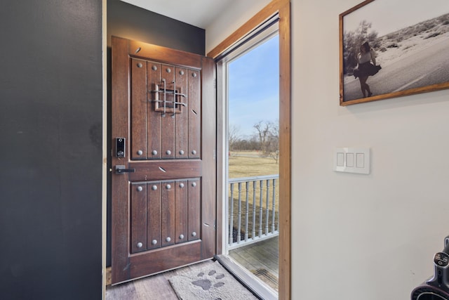 doorway to outside featuring wood finished floors