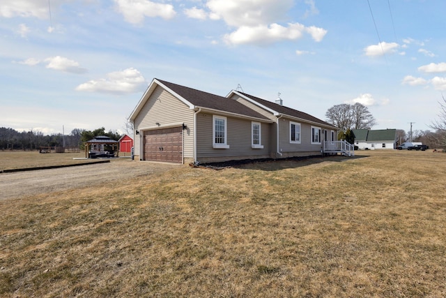 view of property exterior with driveway, an attached garage, and a yard