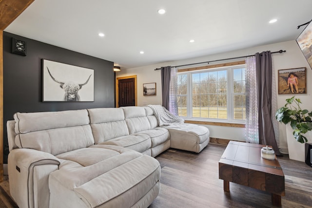 living room featuring recessed lighting, wood finished floors, and baseboards