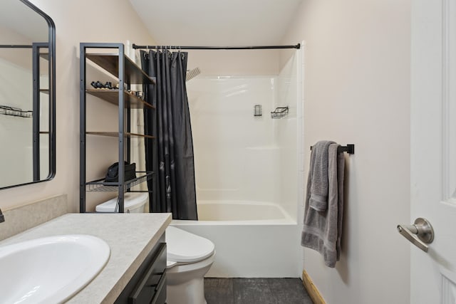 bathroom featuring toilet, shower / bath combo, and vanity