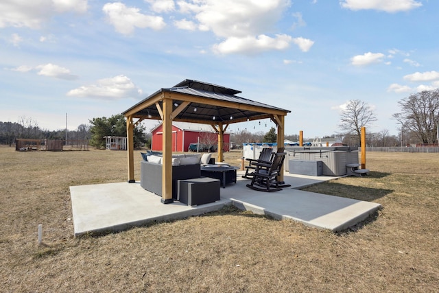 view of patio / terrace featuring an outbuilding, an outdoor fire pit, a storage unit, and a gazebo