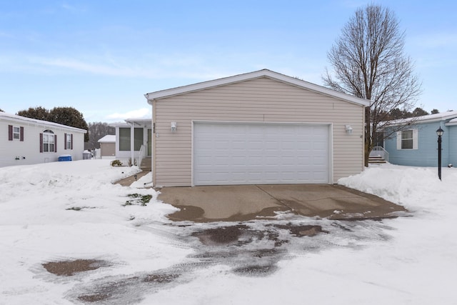 view of snow covered garage