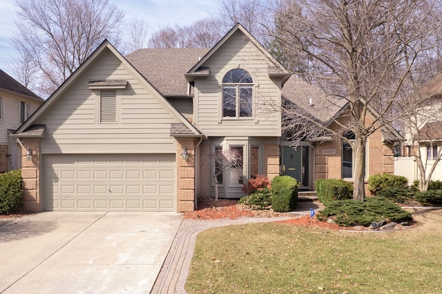 view of front of house featuring brick siding, driveway, a front lawn, and roof with shingles