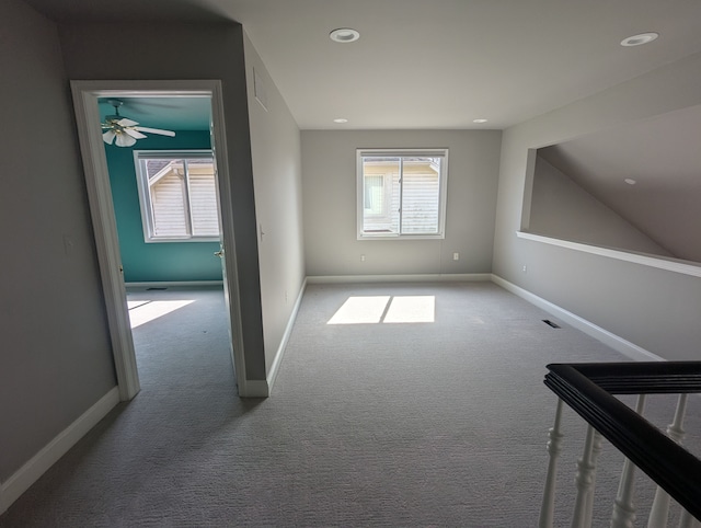 interior space with recessed lighting, baseboards, carpet floors, and visible vents