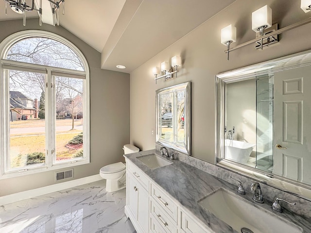 bathroom with lofted ceiling, visible vents, marble finish floor, and a sink