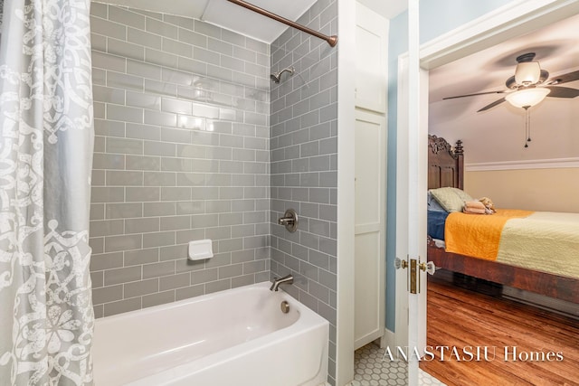 full bathroom with tile patterned floors, ensuite bath, ceiling fan, and shower / bathtub combination with curtain