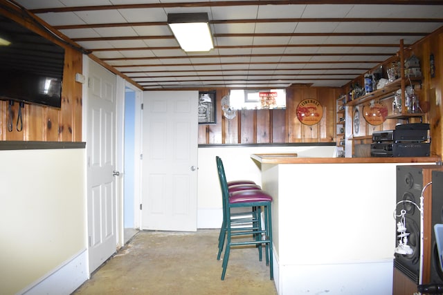 bar with a bar and concrete flooring