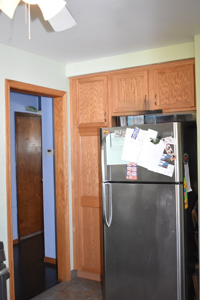 kitchen featuring freestanding refrigerator and ceiling fan