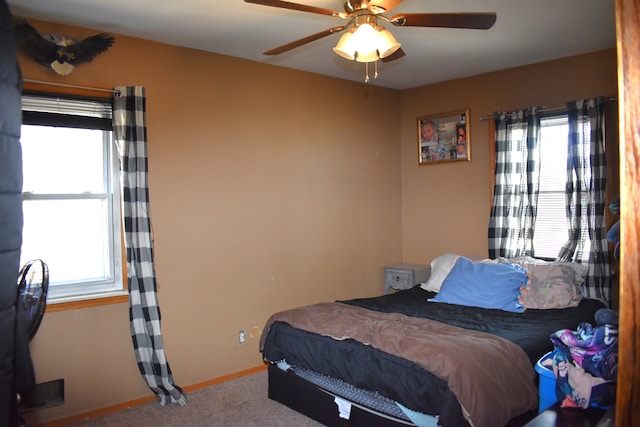 bedroom featuring baseboards, carpet, and a ceiling fan