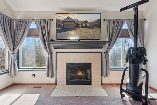 511 State St, Oxford, MI 48371 - living area featuring carpet, baseboards, and a fireplace