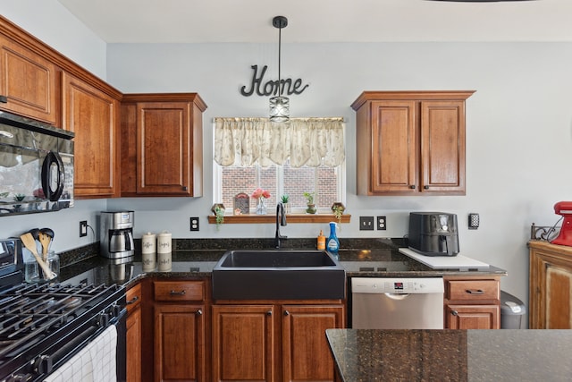 511 State St, Oxford, MI 48371 - kitchen featuring black appliances, a sink, brown cabinetry, and dark stone countertops