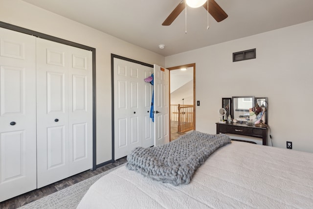 511 State St, Oxford, MI 48371 - bedroom featuring multiple closets, wood finished floors, and a ceiling fan