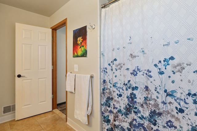511 State St, Oxford, MI 48371 - bathroom with tile patterned flooring, baseboards, and curtained shower