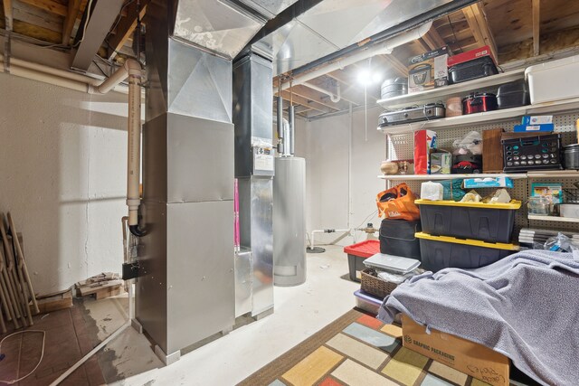 511 State St, Oxford, MI 48371 - unfinished below grade area with water heater