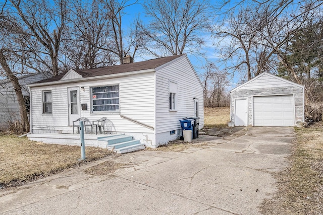 view of front of property featuring a garage, a chimney, an outdoor structure, and driveway