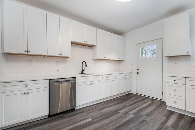 kitchen featuring dark wood-type flooring, a sink, white cabinetry, light countertops, and dishwasher