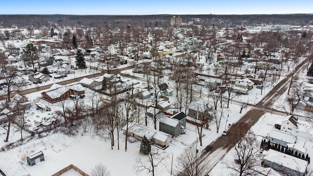 snowy aerial view featuring a residential view