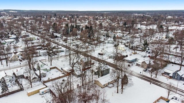 snowy aerial view featuring a residential view