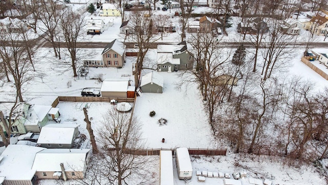 snowy aerial view featuring a residential view
