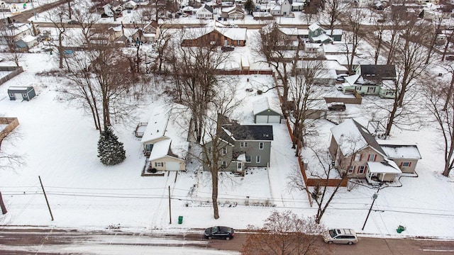 snowy aerial view featuring a residential view