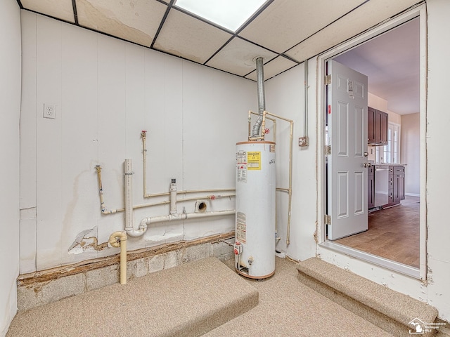 utility room featuring water heater